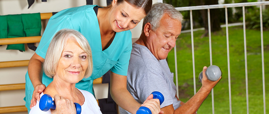 caregiver assisting seniors in exercising