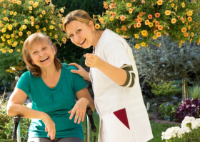 happy senior woman with a caregiver